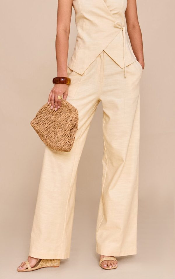 7a2c21a06f92f493847a9111fc2518f53f820316_CNM6318_2_almond_textured_pleat_mid_rise_wide_leg_trousers