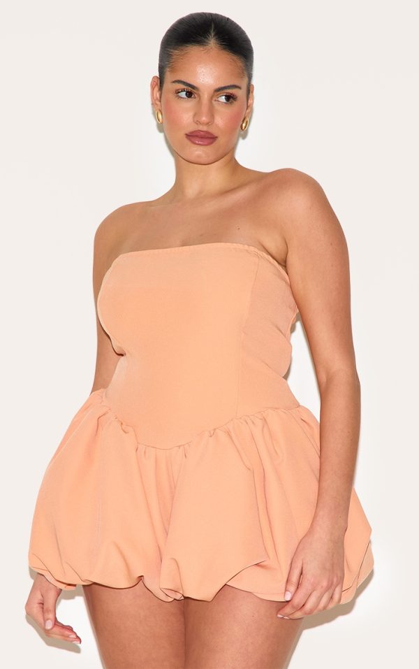 7ba21ca41792bf2eedfd5710112267e7e07bf5fa_CNM2024_4_plus_apricot_contrast_woven_bandeau_puffball_playsuit