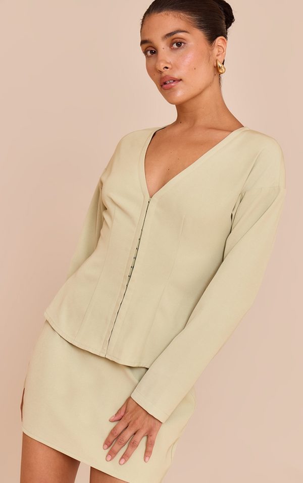 7d39c3087b6b3c86f4c759d0bb38807abf28c918_CNM7001_4_petite_soft_olive_mid_rise_mini_skirt