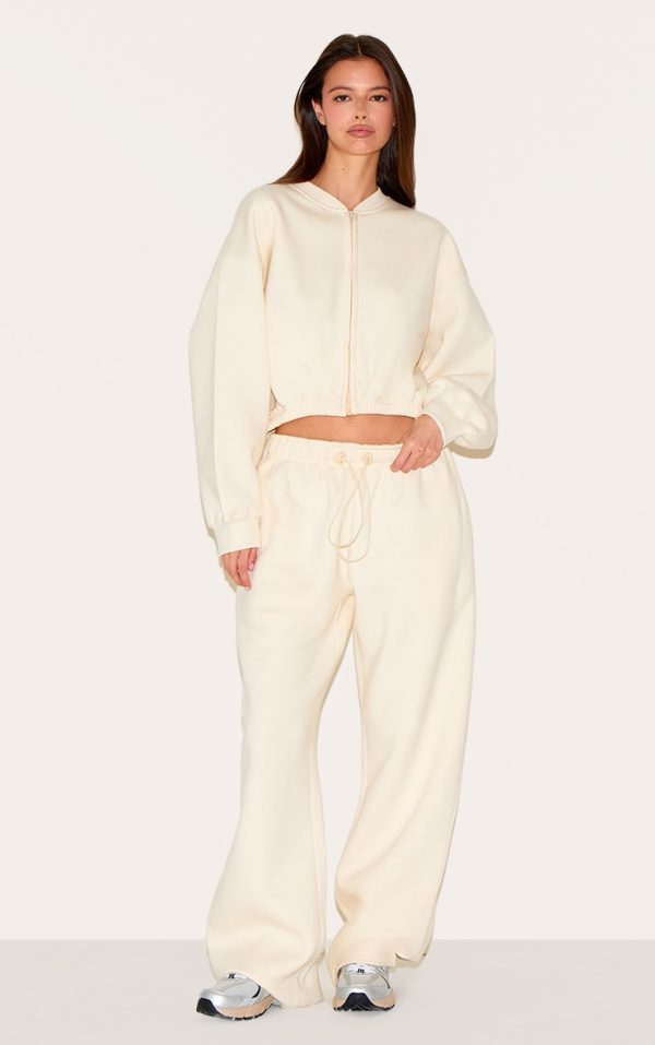 7d6c4f133a3441c7c7d66284b2c36f9dd2dde407_CNM7125_3_cream_drawcord_waist_cropped_zip_up_sweatshirt