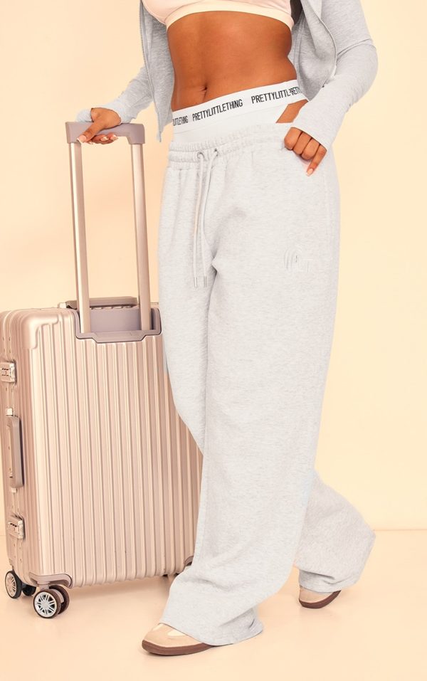 7f90618be393991eb0822ca60ddccb1f7fb9fc72_CNJ8766_2_prettylittlething_grey_marl_embroidered_graphic_wide_leg_joggers