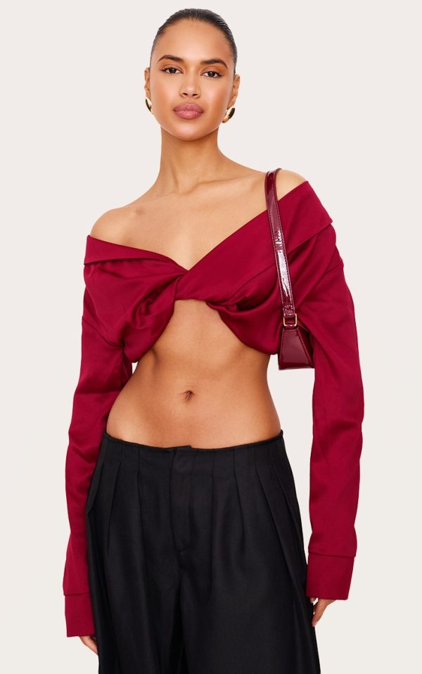 812aa005ea591c5e572012d6d708766267b620f8_CNL6015_1_burgundy_satin_bardot_twist_front_crop_blouse