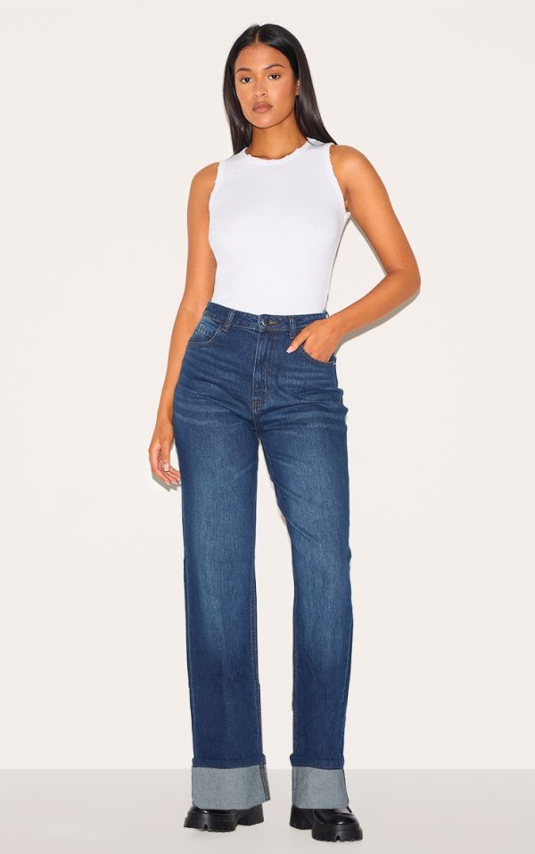 8153df393e728dc3f68d8ed195cbda53ea160432_CNJ2048_1_tall_dark_indigo_mid_rise_distressed_turn_up_hem_jeans