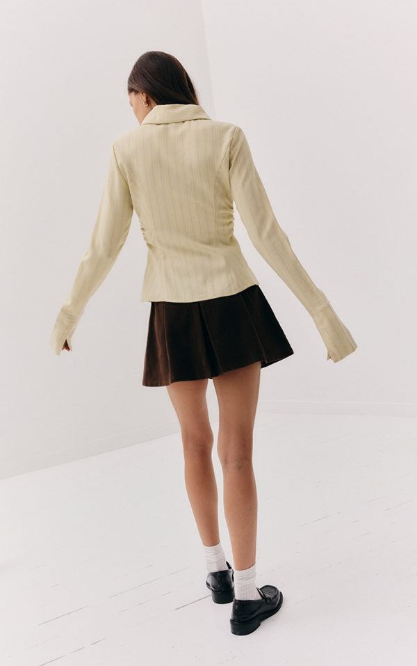 8306a6aea19fa764636715c35c45b605de82bef2_CNM0629_3_chocolate_faux_suede_pleated_mini_skirt
