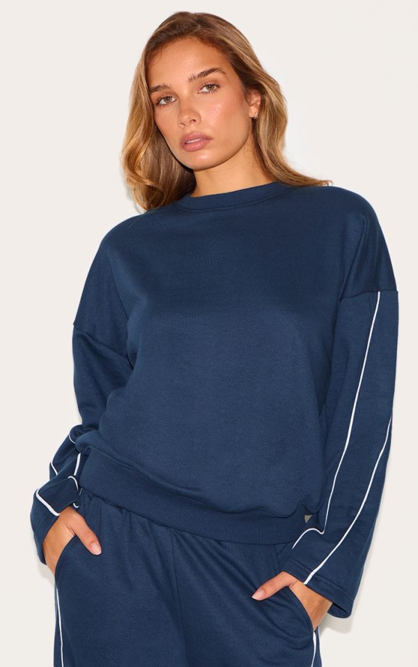 83323e5e03bf4e51dea06c870516a6305dd9a800_CNL8649_1_navy_contrast_piping_detail_sweatshirt-1