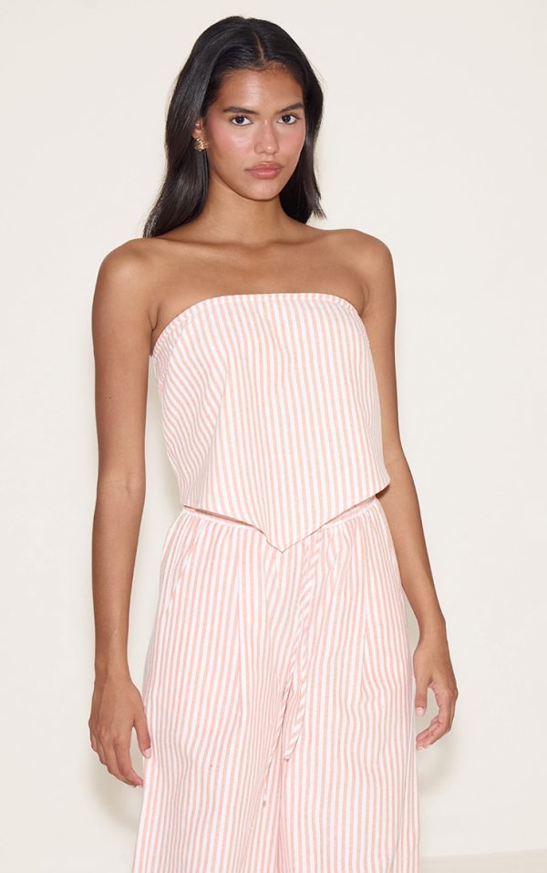 8374b0844bb52c120b8f556b9202b7bd958aa8f8_CNM8812_1_orange_pinstriped_bandeau_dipped_hem_top