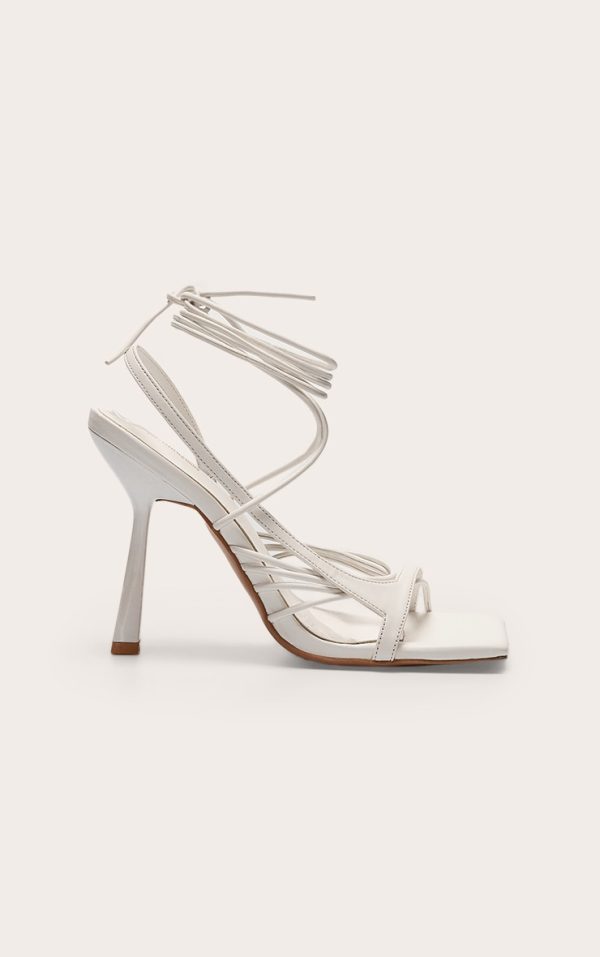 83b2974e25cf2e7b3c0d15a6af15a223766058b9_CNM0647_1_white_pu_square_toe_asymmetric_strappy_lace_up_high_heel_sandals