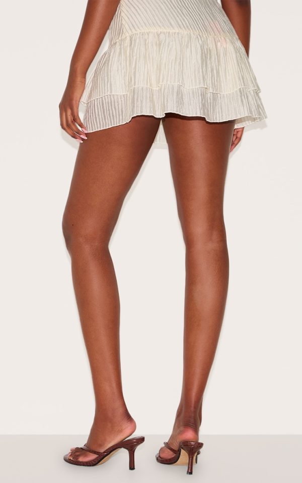 8473eebf8261d3179de134be02270d8605b1f69b_CNL9322_3_almond_crinkle_woven_dropped_waist_frilly_mini_skirt