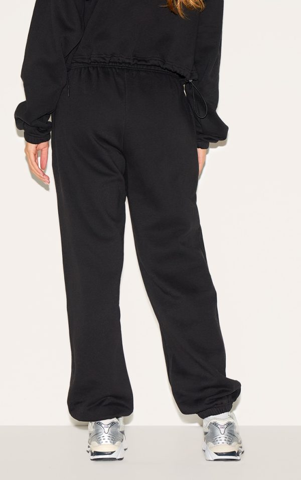 857a81da71508dff6f124299b734b1804a4cbed5_CNK1542_3_prettylittlething_black_oversized_cuffed_joggers