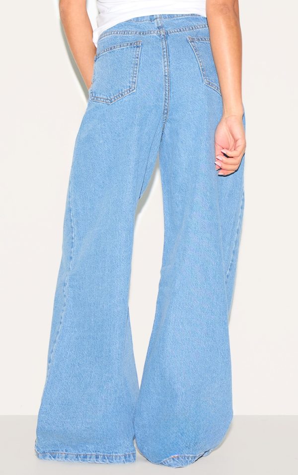 87bf0146b8de8bfbc1af40535ee37e651bf5b479_CNL7054_3_petite_mid_blue_wash_low_rise_tie_waistband_wide_leg_jeans