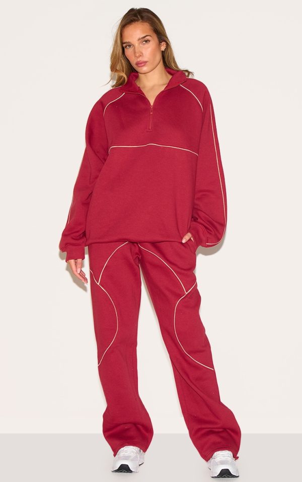 87f31706b43077b88e2f2de364a4fdf56ba152cc_CNM4813_1_red_oversized_contrast_piping_straight_leg_joggers