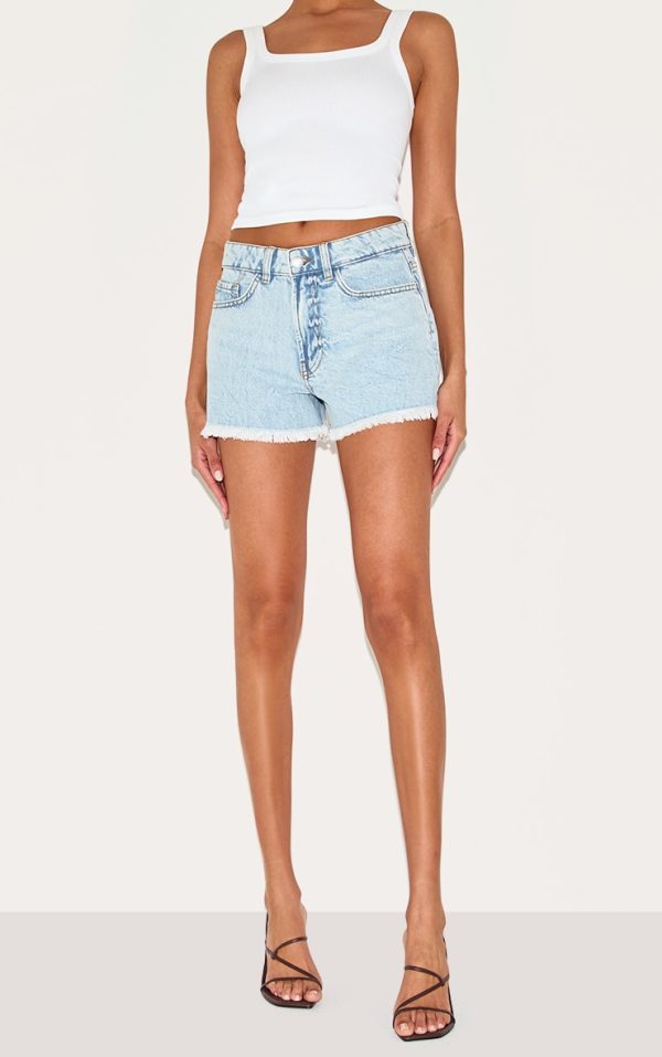 8992bce1e5e4c29e45a3ee71397a2e1a905f8871_CNI3647_2_light_blue_wash_distressed_mid_rise_basic_denim_shorts