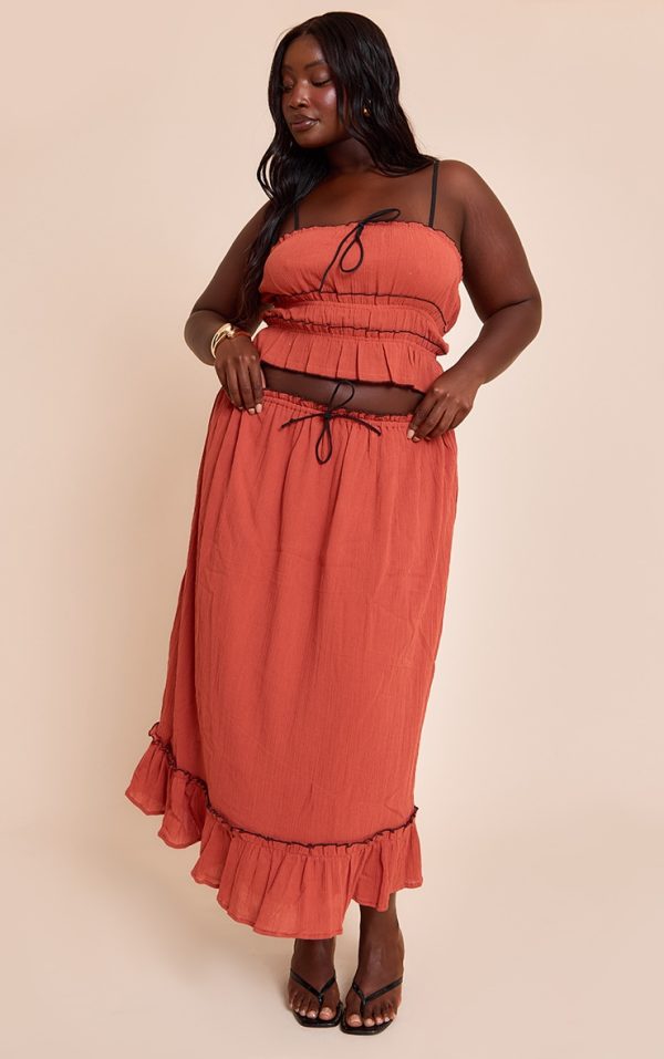 89e3fa7c3e67437aaad82bc9534f1e33a2bcbd7c_CNM5070_3_plus_rust_cheesecloth_cami_contrast_top