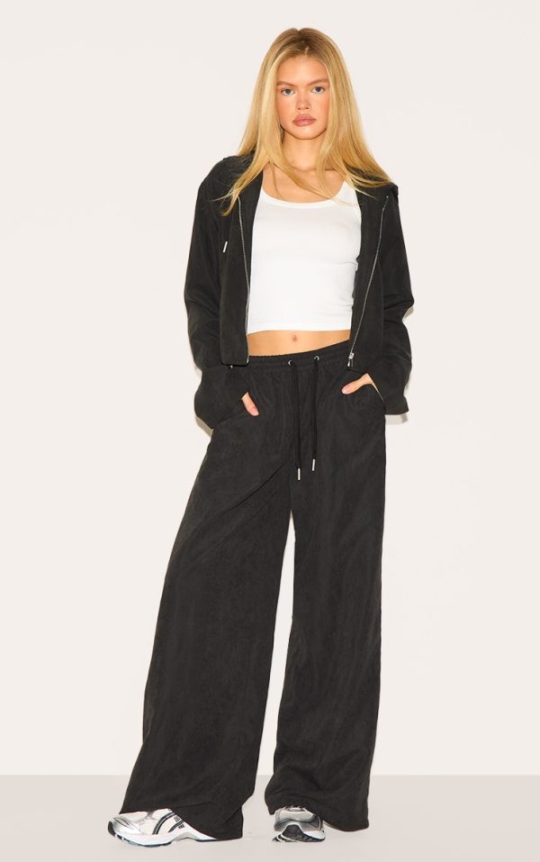 8a047a91811e6bd5a16854c2eff693c850e3293c_CNM0139_1_black_peach_skin_woven_wide_leg_trousers