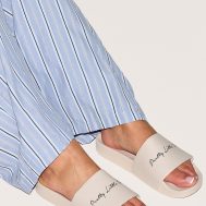 8a772701f7e5fd734f8057c1eb85145851afe248_CMO1155_5_prettylittlething_beige_slogan_sliders