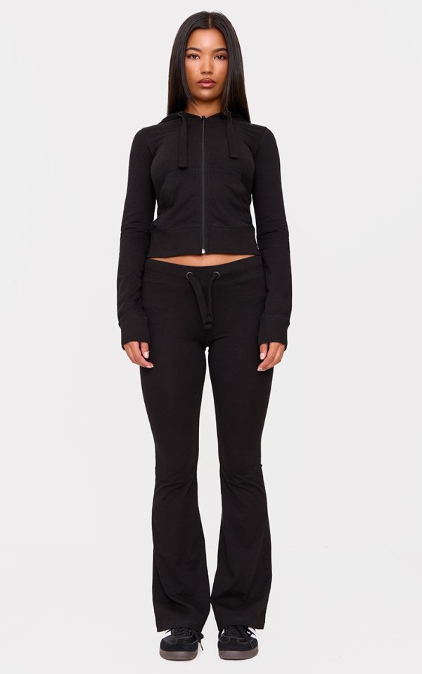 8b36d28544765735067ca7a6e7db21e9486a7f89_CNL6873_1_black_low_rise_skinny_flare_trousers