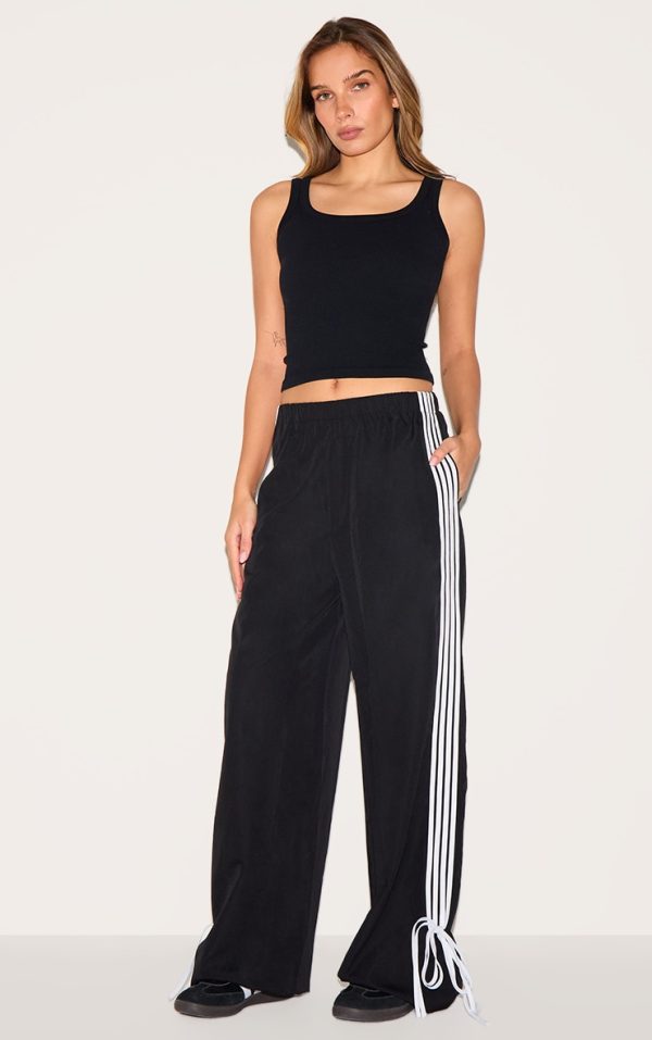 8d704236247ae62ee84cce08ac9243845cf44719_CNI1148_1_black_shell_bow_detail_track_pants