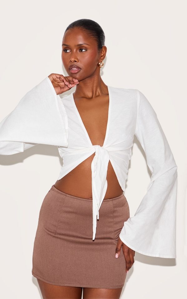8e078c806a3324dfe199cae5feee7d4939d5d72c_CNM4653_4_white_lightweight_woven_knot_front_drape_detail_blouse