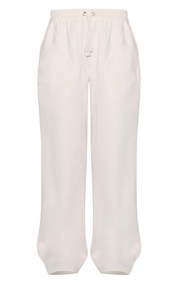 8e5af93f78b77211e1d69dbf22f50460a0c26fb3_CNJ8741_5_cream_embossed_drawstring_joggers
