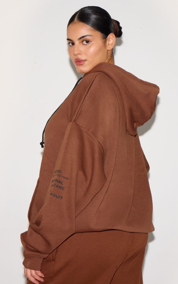 8e79a595f15fa81a551a65ff3acbc2a33490e60b_CNE5424_2_prettylittlething_plus_chocolate_oversized_fit_slogan_printed_hoodie