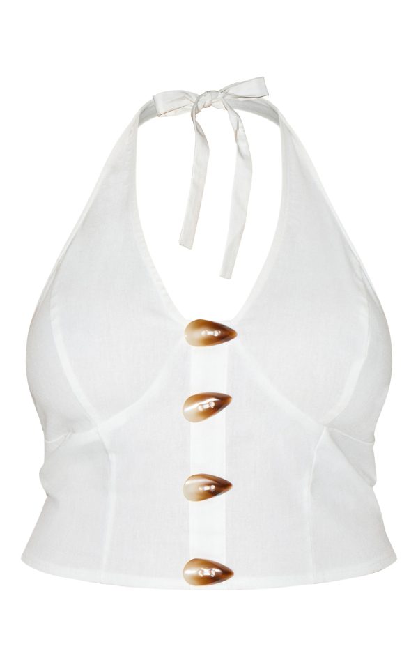 8f715a0c1a0a276b90bb0d5e7beae4bc259def17_CNN0786_5_plus_white_woven_halterneck_button_detail_top