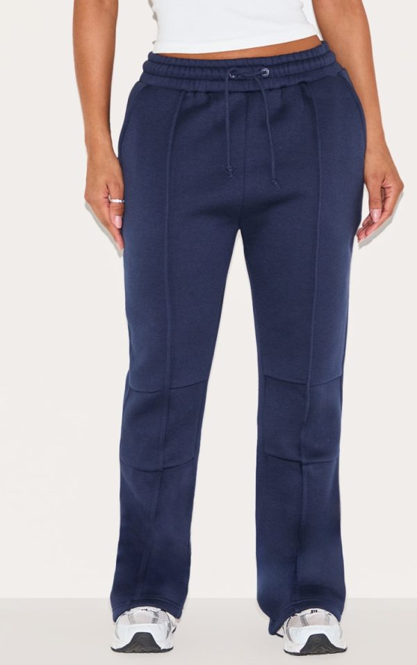 91f6ff3203d2eda84e9da06b4533e4db8901a43a_CNM0018_2_shape_navy_highwaisted_pintuck_flared_joggers