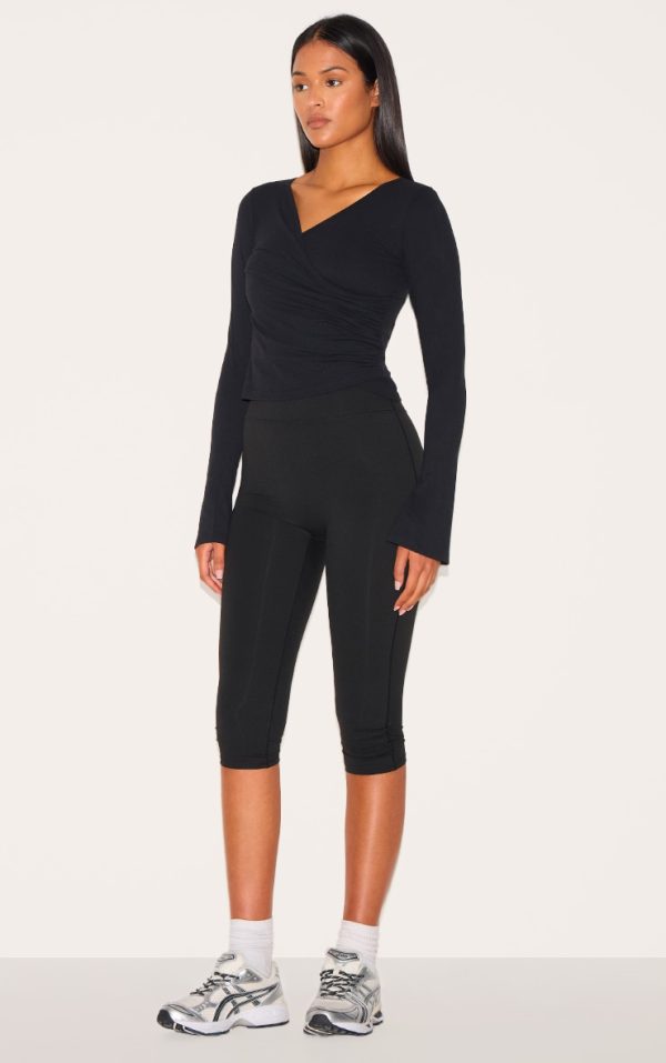 930b2d0f861c9d973db6d9213504bfcf3179f1b9_CNM1100_3_tall_black_contour_sculpt_asymmetric_long_sleeve_top