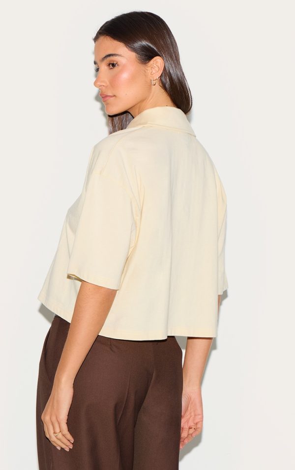 94f4d38be34b4322af436c90171bcd44fdf34e98_CNM6623_2_cream_oversized_short_sleeve_polo_top