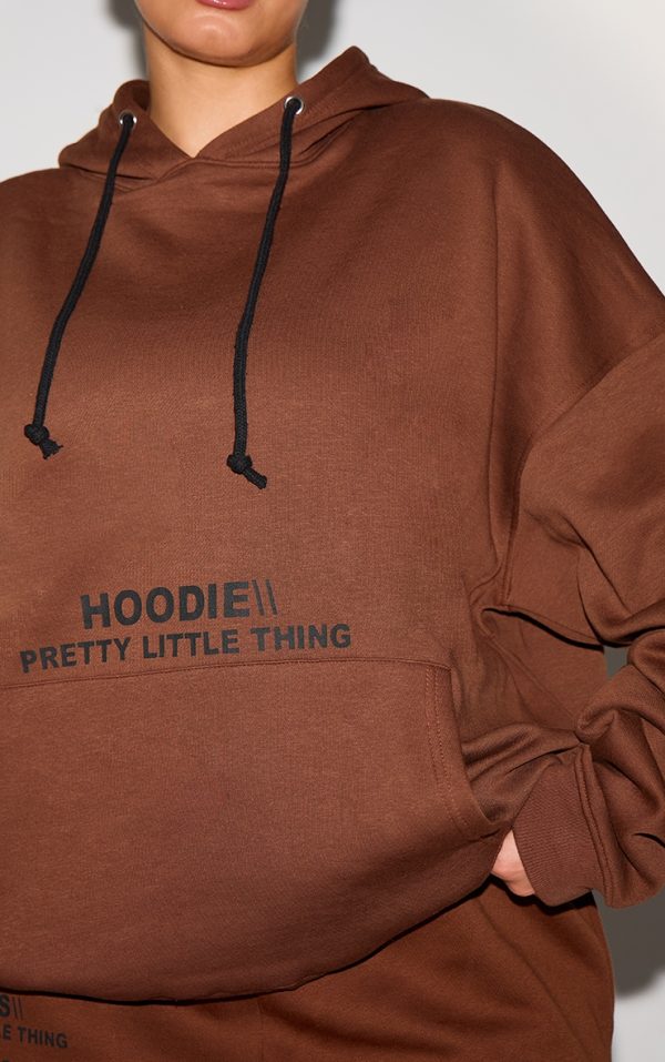 9521a19ec6367d8a7caa63b5a1f76a862675bb08_CNE5424_4_prettylittlething_plus_chocolate_oversized_fit_slogan_printed_hoodie