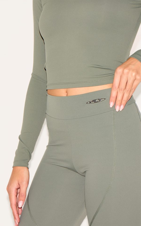 95ff2da56fa4d02782d7622c856a4a65733f6025_CNK6492_4_olive_sport_metal_badge_sculpt_high_waist_flare_trousers