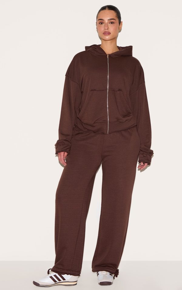 965326c0c1d17473bd4d7c1a520d6cd1519bcb88_CNM1974_1_shape_chocolate_highwaisted_back_slogan_joggers