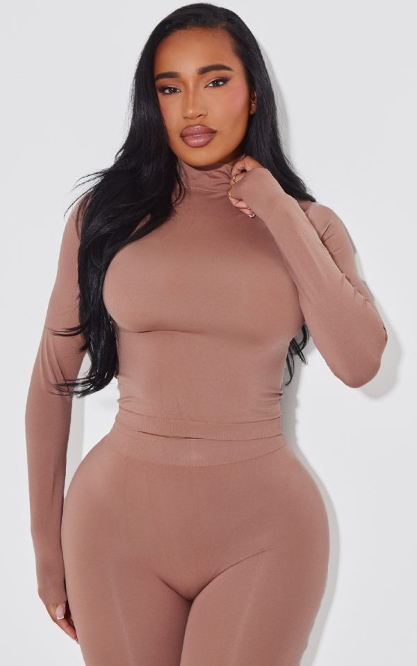 96c1de526766acddf03aa622c573b24bc4e57b3c_CNJ7986_1_shape_taupe_stretch_seamless_high_neck_long_sleeve_top