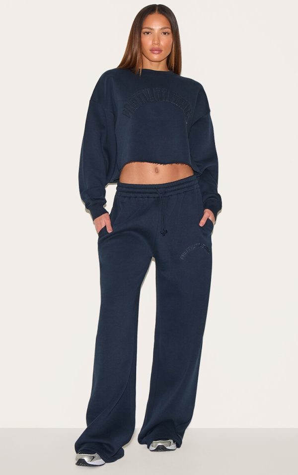974dc0f2e3e239977ee51b3688bb2b1f2157e6d8_CNM2679_3_tall_navy_distressed_detail_varsity_cropped_sweatshirt