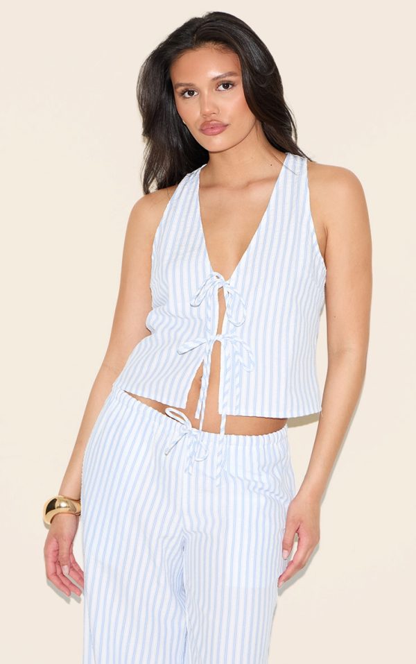 97864395434e9788de76468f039f3bf64048c682_CNM1751_1_blue_striped_sleeveless_tie_front_top
