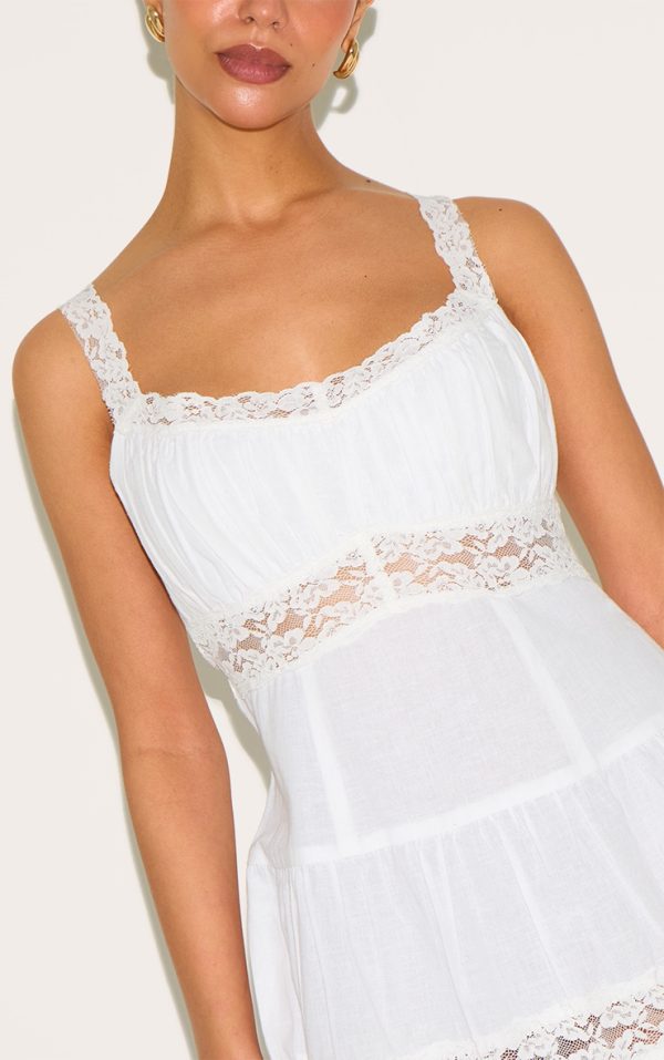 99114339d40e6fb95c640deb49716655ed178704_CNM4417_4_petite_white_tiered_mini_dress_with_lace_details