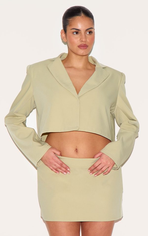 99247ffc5863a70106f717a0dfd3444326c8e2bf_CNM5657_4_plus_sage_green_tailored_woven_boxy_cropped_bow_detail_blazer