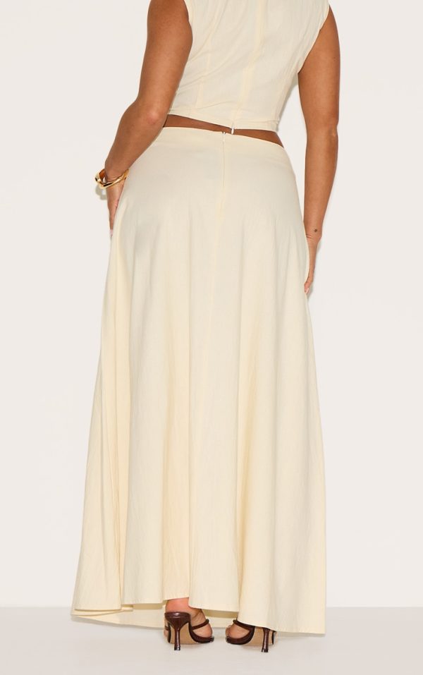 99904c0e899aca1a5397504704b30ad959856c42_CNM6337_3_shape_cream_linen_fold_gold_wave_trim_maxi_skirt