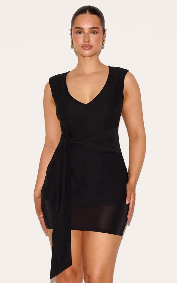 9de83c4abed3435b7b371db11fff7a71253c5ef0_CNM3022_1_shape_black_stretch_woven_plunge_front_belted_long_line_top