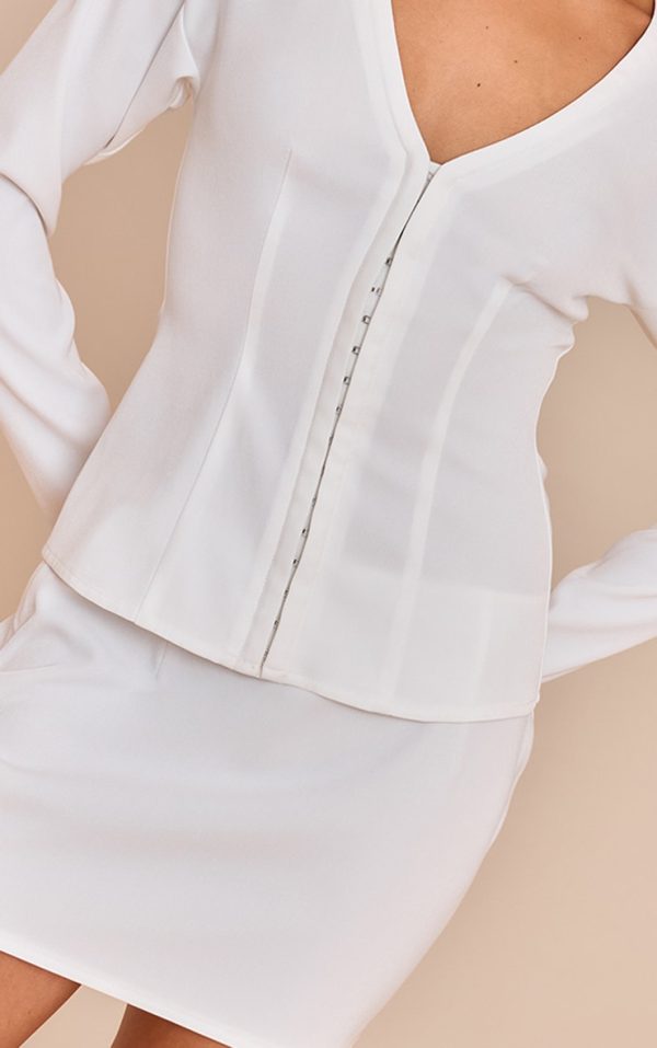 9dfac37db626bbb779a1bf7670ab5df64920cf01_CNM7002_5_petite_white_mid_rise_mini_skirt