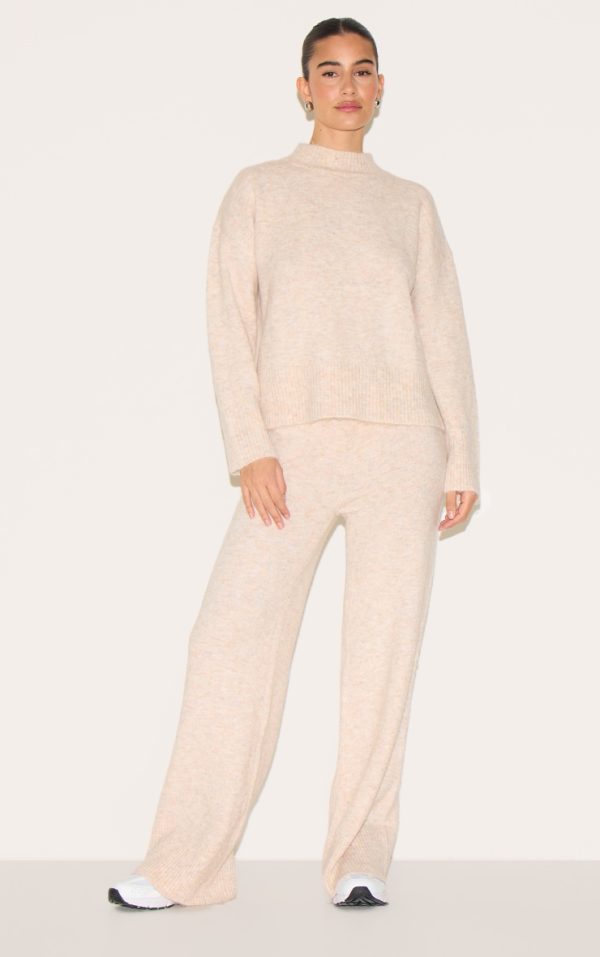 9e81765c52171ed5596b6bb4e536da91467a8c69_CNG7663_3_stone_luxe_knit_high_neck_open_back_jumper