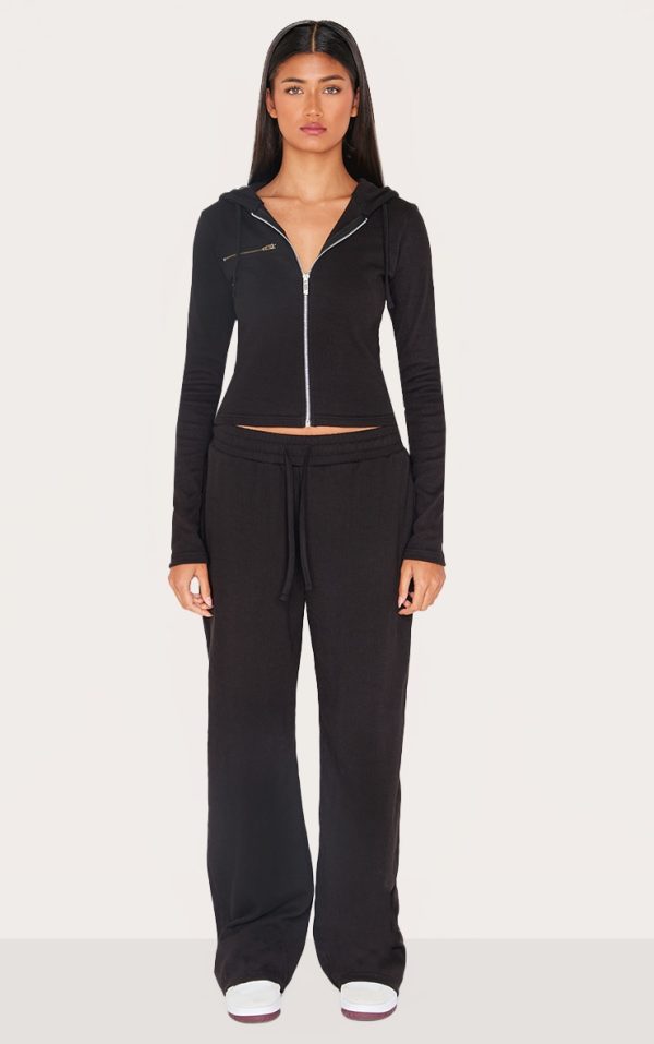 9e8607da13693dcec1ee0c071c88876f29baf677_CNL4848_1_black_ribbed_low_rise_wide_leg_trousers