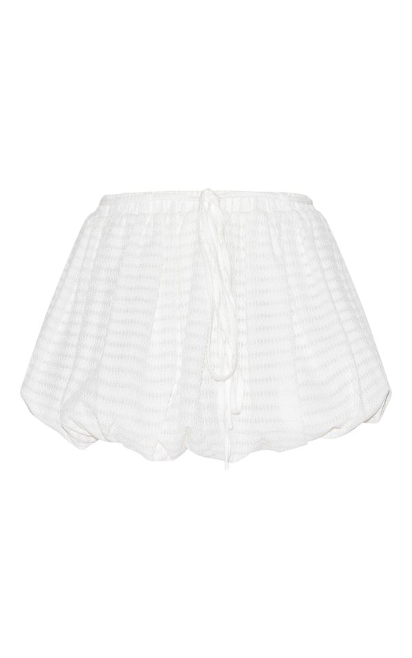 a0e5eb9a0ed4182e2718721351ac6dd1c1678857_CNM0509_6_white_textured_tie_waist_detail_puffball_mini_skirt