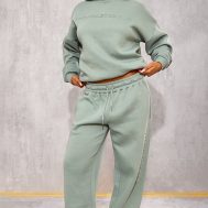 a41d5a8c031bb7b6d618794be3c8188f89232a9b_CNK1767_1_prettylittlething_sage_athletics_club_embossed_straight_leg_joggers