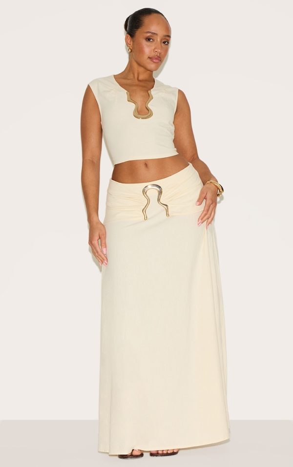 a6949e8ff022273cca9d1ea09e6262a95459887f_CNM6335_3_shape_cream_linen_gold_wave_trim_crop_top