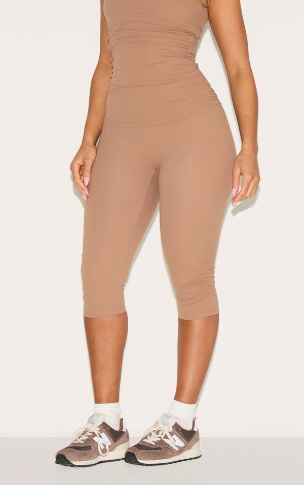 a6aca54a4d2198ed08d89005765fdd585512831d_CNM0984_1_shape_taupe_active_ruched_side_high_waisted_capri_pants