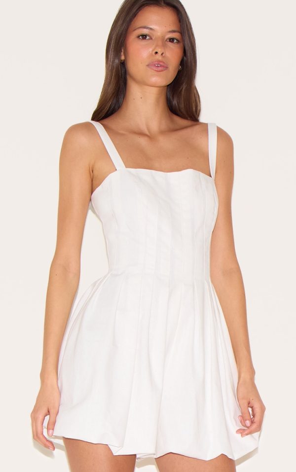a77ca7052d723f4e9059037aaa16b71ad00e7ee5_CNL9243_4_white_twill_pleated_puffball_playsuit