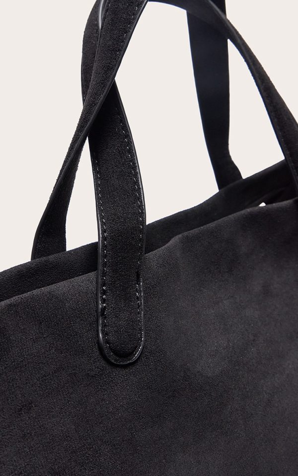 a7f44521a7262cf1d77a9476e52bb3bfefab67b0_CNL9836_3_black_faux_suede_elongated_hand_bag