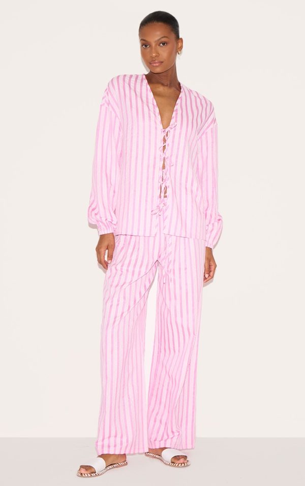 a8ea2d5f339c183366e1a2264c77fd69e209e95a_CNM1733_1_pink_striped_textured_tie_drawstring_wide_leg_trousers