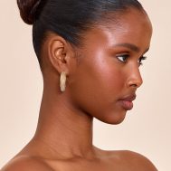 abb4e41fbc1995bbf393db7017ed6a301851297d_CNN3114_1_gold_edged_beige_resin_hoop_earrings