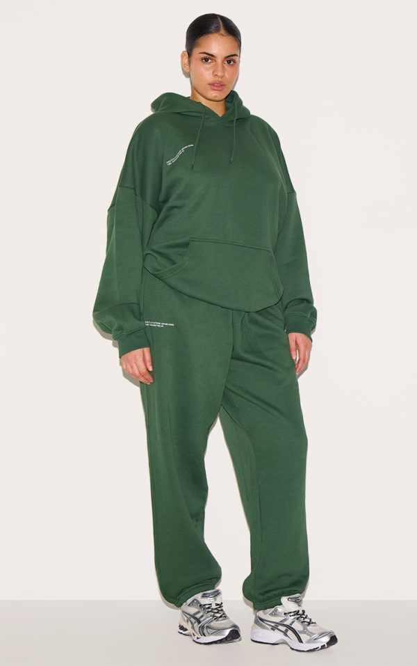 acf929defc87c04130d11031412f8d8a04e32073_CNG1358_3_prettylittlething_plus_forest_green_est_2012_printed_oversized_hoodie